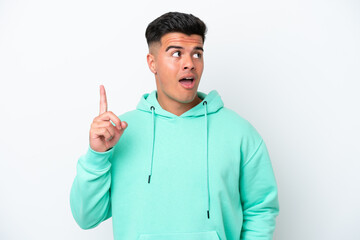 Young caucasian handsome man isolated on white background thinking an idea pointing the finger up
