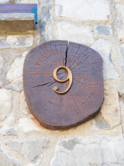 clock on the wall of a church. number one on wood