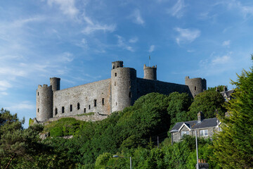 Low angle view of medieval fortification Harlech Castle in Harlech, Gwynedd, Wales, UK built on a rocky knoll by Edward I during his invasion of Wales