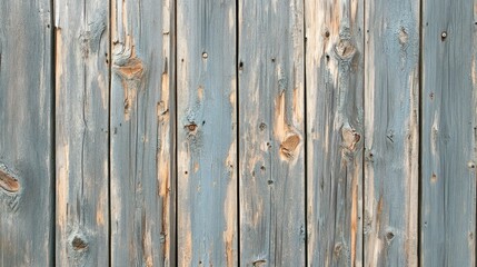 Fototapeta premium Detailed shot of a weathered wooden fence texture with chipped paint and visible grain patterns.