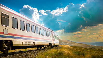 Fototapeta premium Dogu Ekspresi or Ankara-Kars Eastern Express train journey through Turkish landscapes, with space for text.