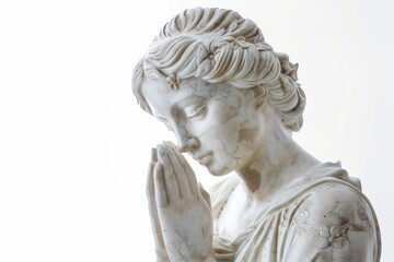 Obraz premium A sculpture of a woman with her hands clasped in contemplation, suggesting prayer or meditation