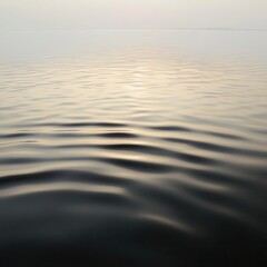 Calm Water Surface with Gentle Ripples and Sun Reflection