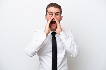 Fototapeta premium Young business caucasian man isolated on white background shouting and announcing something