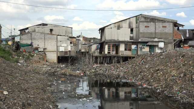 Makeshift homes in heavily polluted slum area in Jakarta, risk of diseases with poor sanitation in Indonesia's capital city


