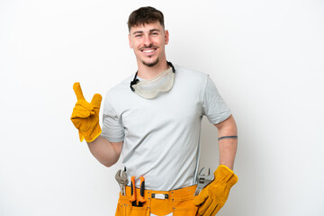 Young caucasian electrician man isolated on white background showing and lifting a finger in sign of the best