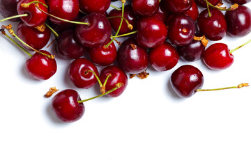 Pile sweet red cherries isolated on white background