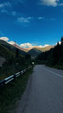 Vertical video of treaking in Kazakhstan. Beautiful mountain road.