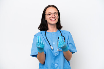 Young nurse caucasian woman isolated on white background making money gesture