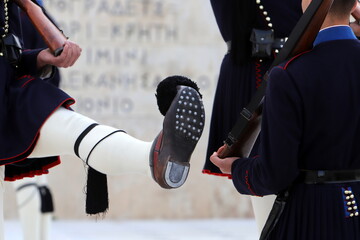 Guards march at the entrance to the royal palace.
