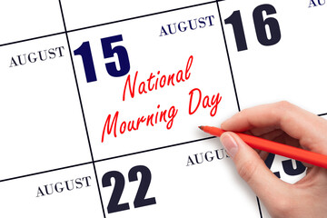 August 15. Hand writing text National Mourning Day on calendar date. Save the date. Holiday. Important date. Day of the year concept.