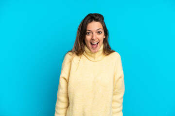 Young caucasian woman isolated on blue background with surprise facial expression