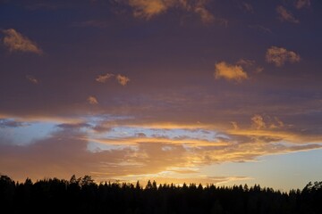 Magical sunset in winter in January over Bredebolet in Skaraborg in Vaestra Goetaland in Sweden on a cold day