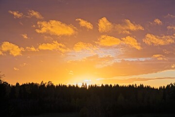 Magical sunset in winter in January over Bredebolet in Skaraborg in Vaestra Goetaland in Sweden on a cold day