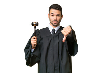 Judge caucasian man over isolated background showing thumb down with negative expression