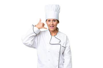 Middle-aged chef woman over isolated background making phone gesture. Call me back sign