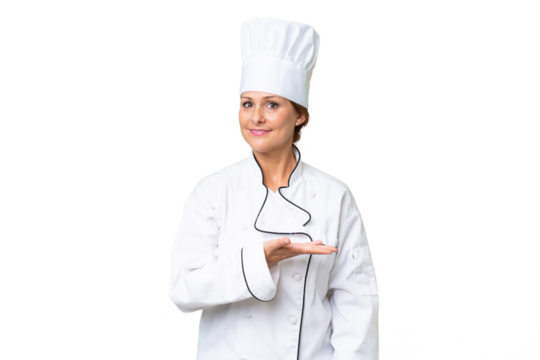 Middle-aged chef woman over isolated background presenting an idea while looking smiling towards