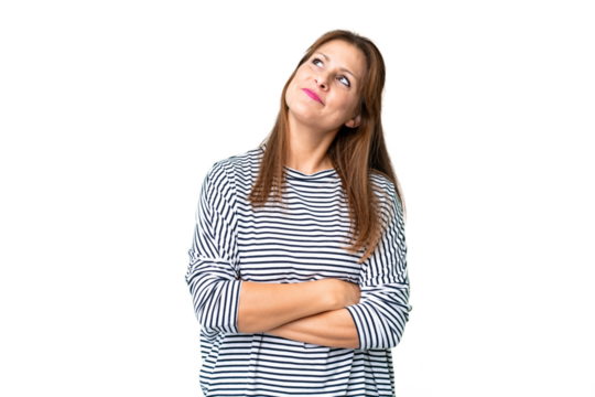 Middle age woman over isolated background looking up while smiling