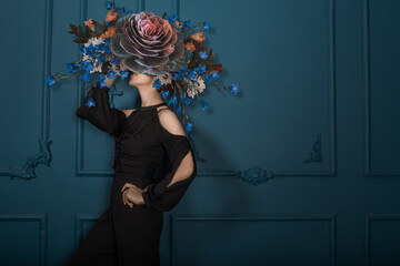 Elegant Woman in Black Dress with Extravagant Floral Headpiece: Surreal Fashion Portrait in Teal...