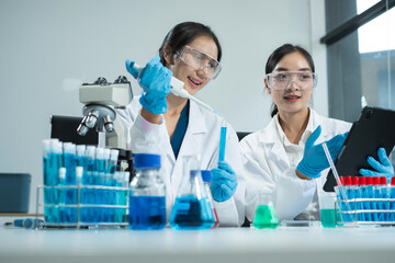 Scientist works with a pipette and a test tube. Scientific laboratory of biotechnology, development...