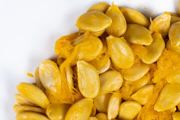 Raw seeds from fresh hokkaido pumpkin on a white background