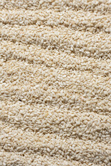 White sesame background, macro top view.