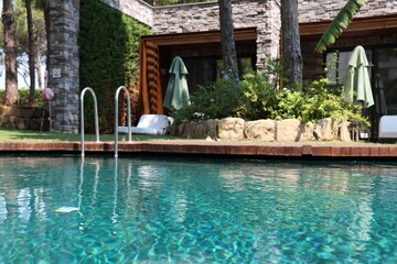 Outdoor swimming pool with clear water at luxury resort