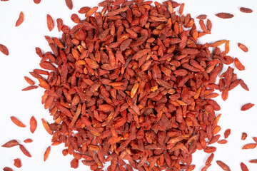 Dried Goji berries Lycium barbarum top view on a white background