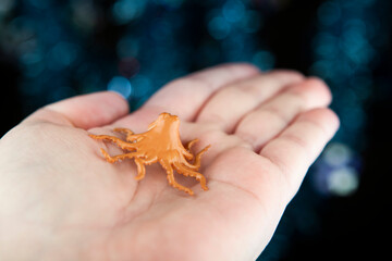 image of octopus hand dark background