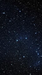 Fototapeta premium A clear, unblemished view of a starry night sky featuring a dense array of twinkling stars against a dark backdrop.