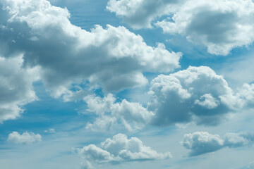 Fototapeta premium Clouds and dark clouds on a beautiful blue sky, dramatic tones in the sky