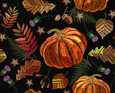 Autumn leaves and orange pumkin. Wild fall forest background. Halloween seamless pattern. Embroidery art.  Fashionable template for design of clothes, t-shirt design