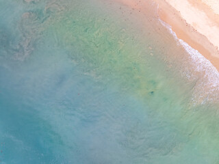 Beautiful sea beach and waves texture in sunny summer day background