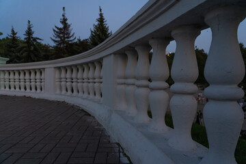 Concrete, vintage fencing with columns. Concrete Balusters. Fencing of the park