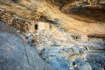 Abandoned arab village with stone houses under the canyon, Balcony walk trail, Jabal Akhdar Mountains, Oman