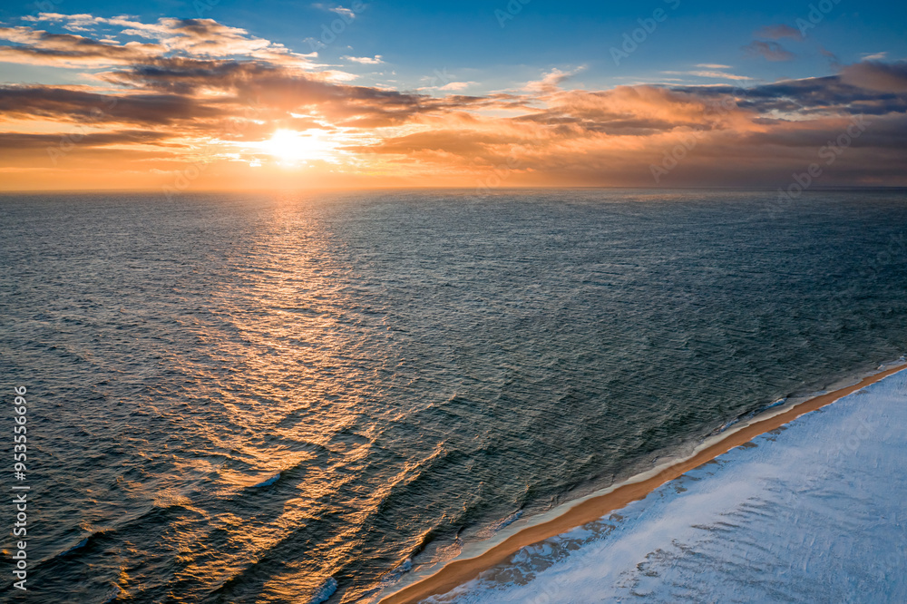 Wall mural Baltic Sea and Hel peninsula in winter at sunrise.