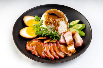 Barbecued red pork in sauce with rice on a white background, Chinese style roasted pork.