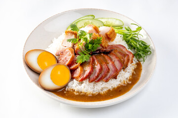 Barbecued red pork in sauce with rice on a white background, Chinese style roasted pork.