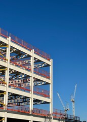 Looking up at modern buildings with a clear blue sky background. Taken in Manchester England. 