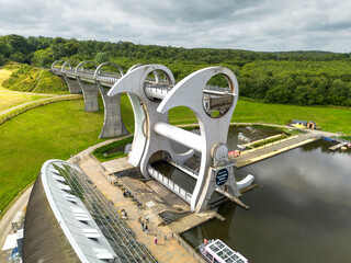 Aerial drone photo of the rotating Falkirk wheel transporting lifting narrow boats in the Forth and Clyde canal with engineering master piece in Scottish highlands