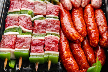 sausage meat assorted juicy pork, beef fresh delicious gourmet food background on the table rustick...