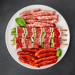 sausage meat assorted juicy pork, beef fresh delicious gourmet food background on the table rustick food top view copy space