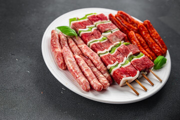 sausage meat assorted juicy pork, beef fresh delicious gourmet food background on the table rustick food top view copy space