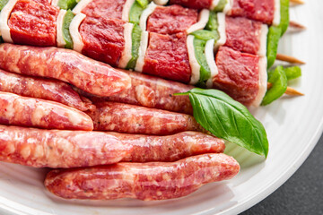sausage meat assorted juicy pork, beef fresh delicious gourmet food background on the table rustick food top view copy space