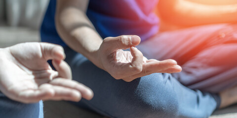 Mantra yoga meditation, spiritual mental health practice, human spirit therapy, mental balance concept with yogi person hands in lotus pose relaxing in peace silently in gym class or home