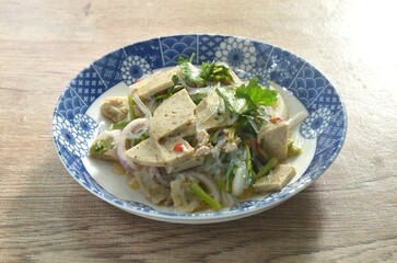 glass noodles with Vietnamese sausage and chop pork spicy salad on plate  