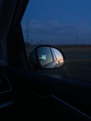 rear view mirror in sunset
