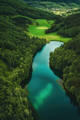 A beautiful green valley with a river running through it. The water is clear and calm, and the trees surrounding the river are lush and green. The scene is peaceful and serene