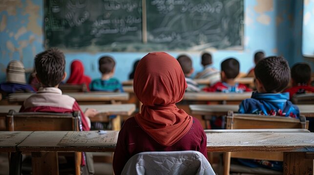 International Day for the Protection of Education. African children sit at desks in a classroom. The concept of getting an education in poor African regions