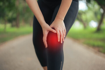A woman is hurting her knee after running. Health problem concept, osteoarthritis problem. Running hard until injured.